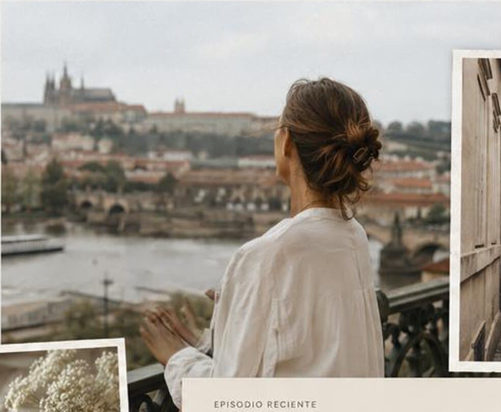 Prague seen from a terrace above the river, a woman looking at the castle.